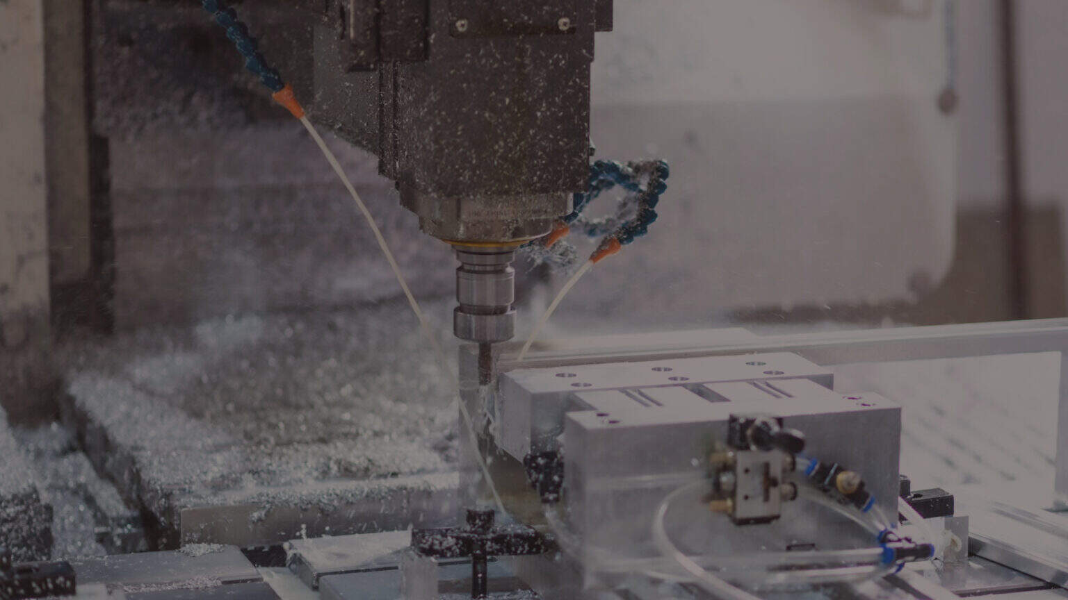 CNC machine on a factory floor with data collected by an industrial edge gateway